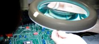 Engineering student working on a circuit board